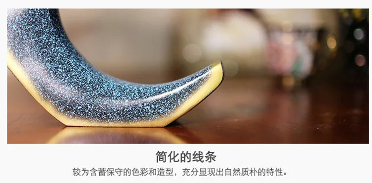 Nutshell resin conch Nordic statue decor with textured curved design on wood surface