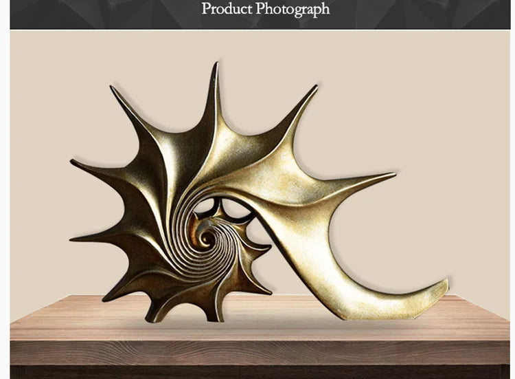 Nutshell resin conch Nordic statue decor in gold finish displayed on wooden surface