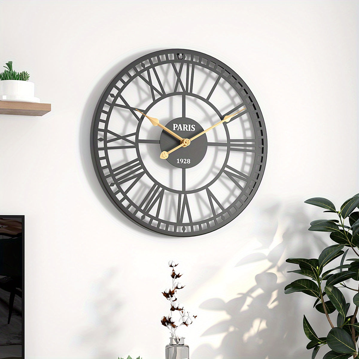 Nutshell Roman numeral wall clock with an elegant black design and bold gold hands