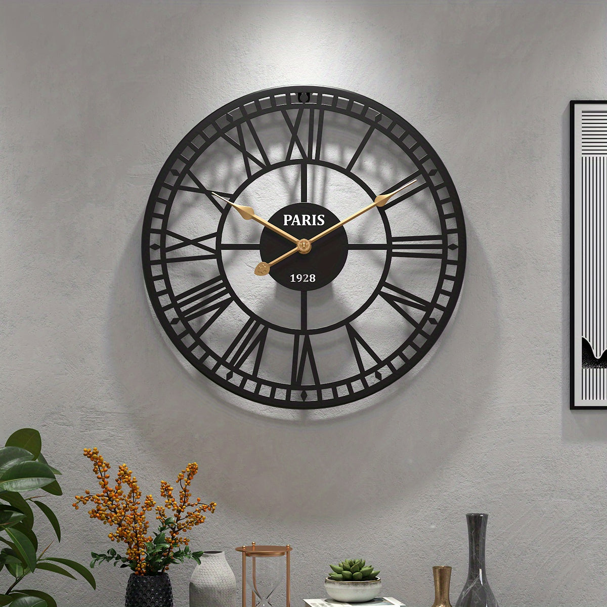 Nutshell Roman numeral wall clock featuring a classic design with black and gold accents