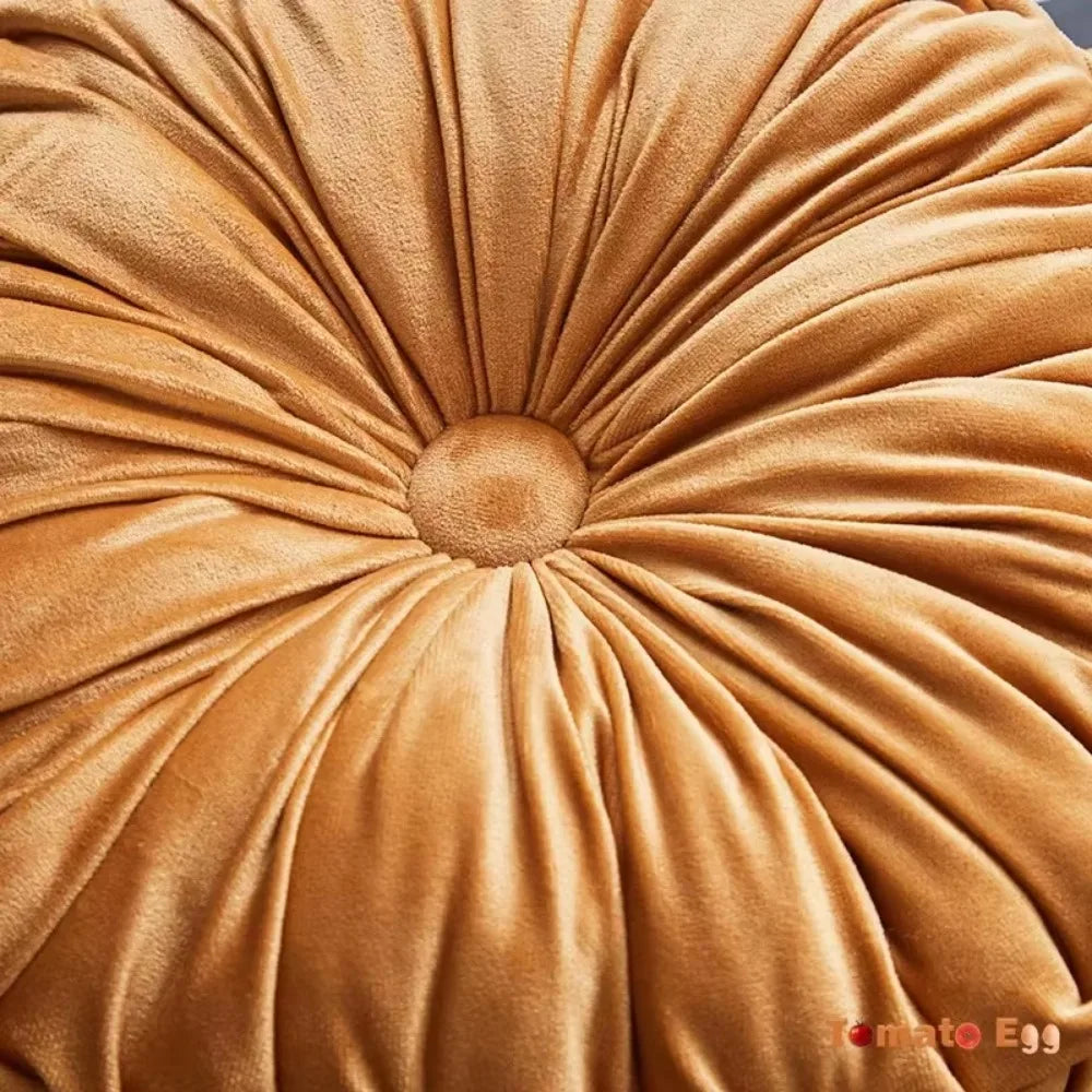 Nutshell soft plush round pumpkin pillow in warm orange with detailed stitching and button center