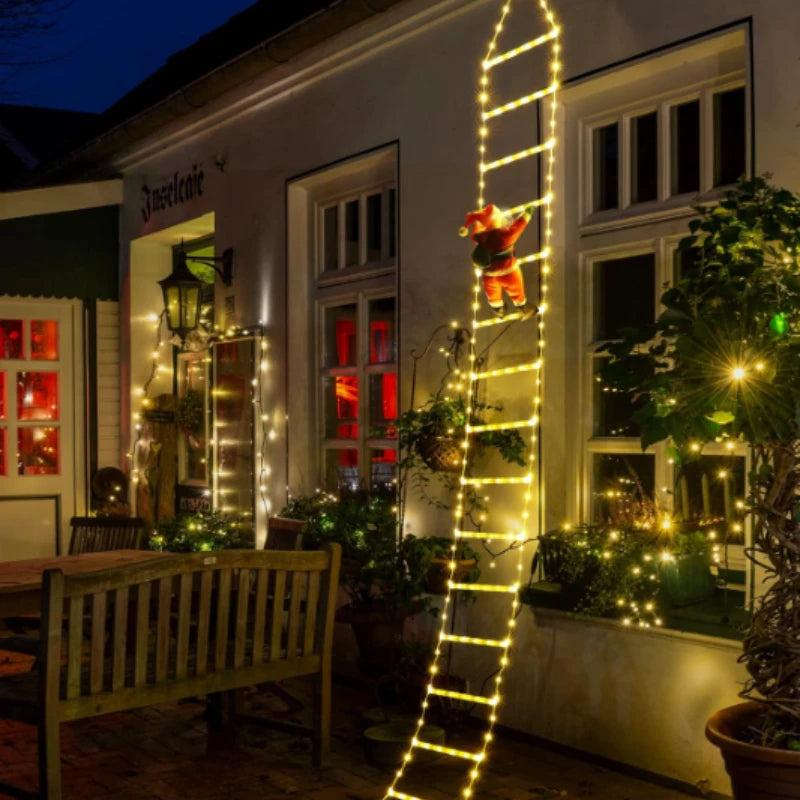 Santa climbing ladder Christmas decoration with bright lights on a cozy outdoor setting