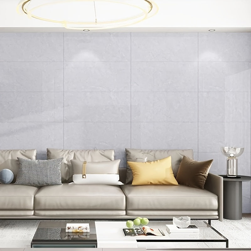 Stylish living room featuring self-adhesive decorative tiles on the wall for modern home decor