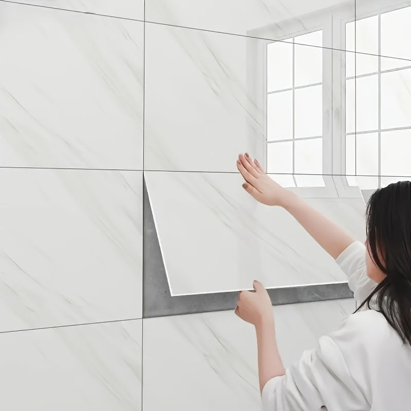 Woman applying self-adhesive decorative tiles in a bright bathroom setting