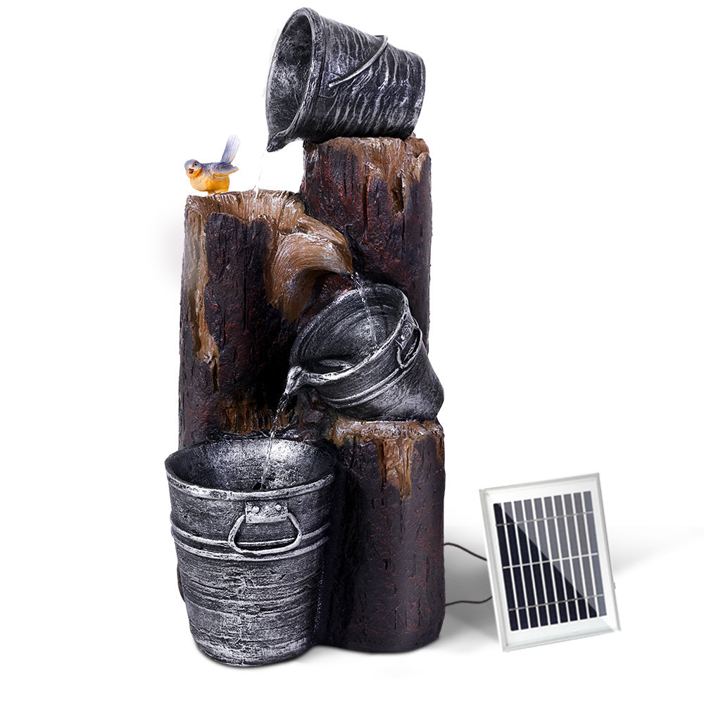 Nutshell solar fountain water feature with three cascading buckets and attached solar panel