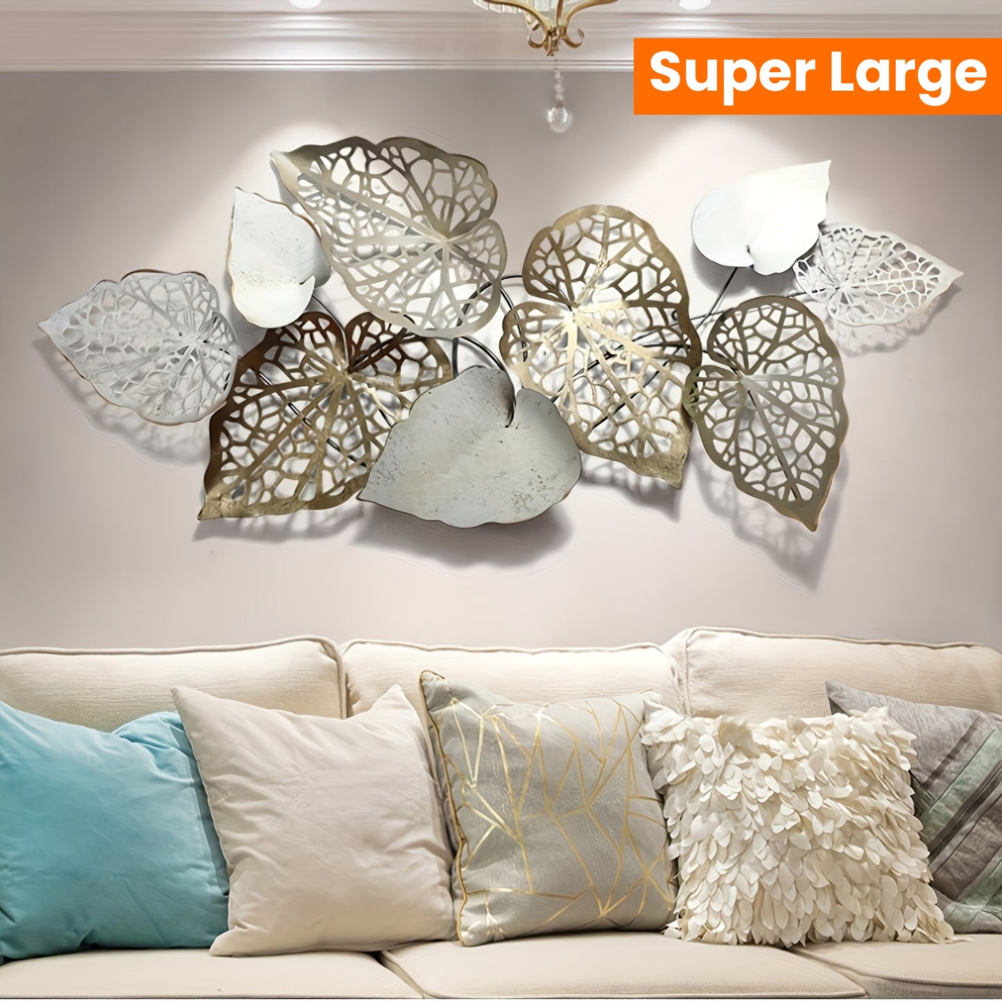 Super Large luxury leaf wall hanging displayed above a stylish sofa with colorful cushions