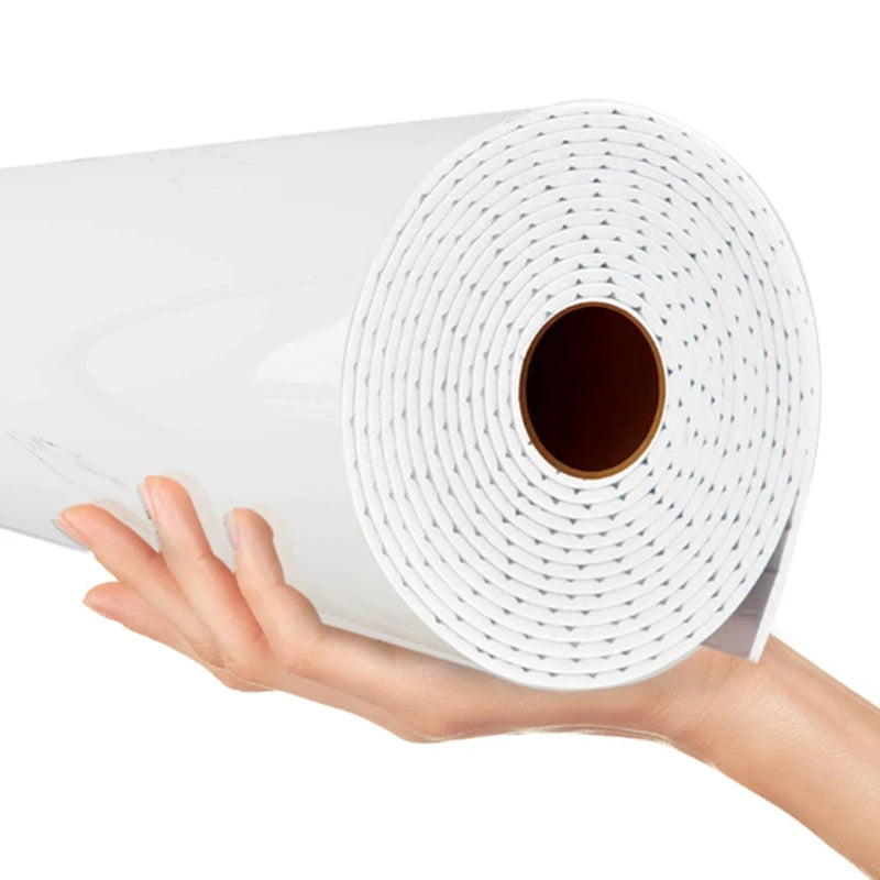 Nutshell white glossy wallpaper roll held in hand showing imitation ceramic tile marble pattern for walls