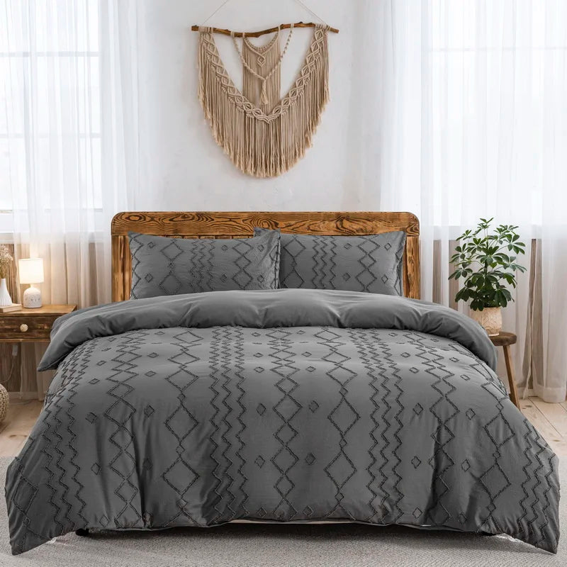 Tufted gray duvet cover set on bed with wooden headboard in bright modern bedroom