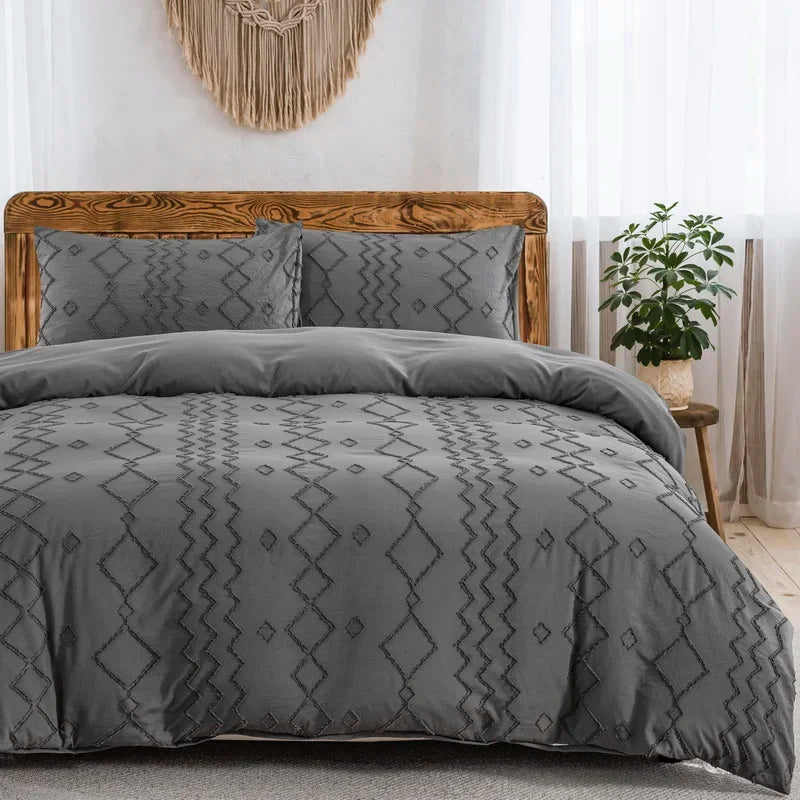 Nutshell tufted gray duvet cover set on a wooden bed with geometric patterns and matching pillow shams