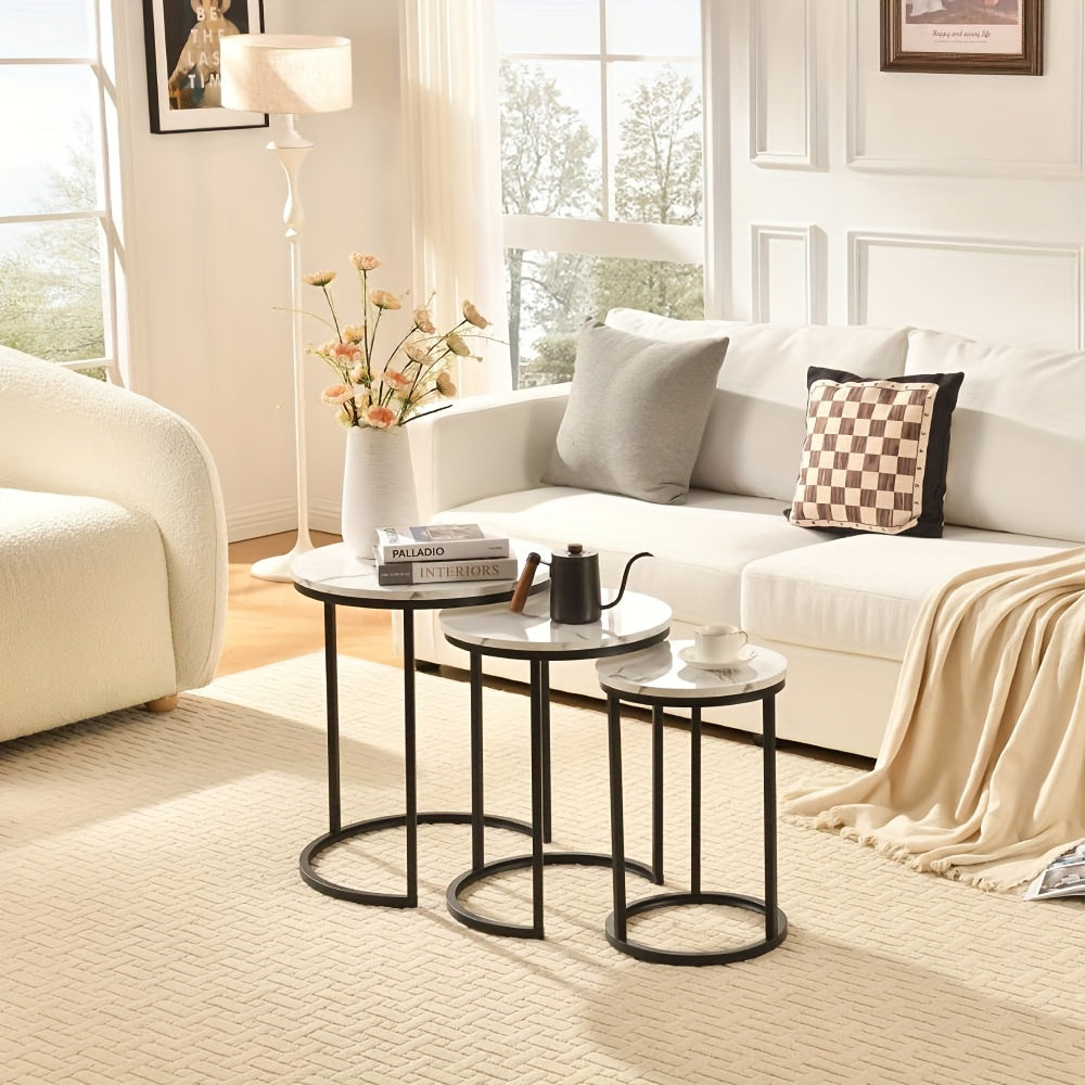 Nutshell modern side table set with black metal frames and white tops in a cozy living room