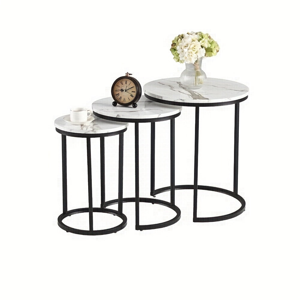 Nutshell modern side table set with three round marble tops and black metal frames
