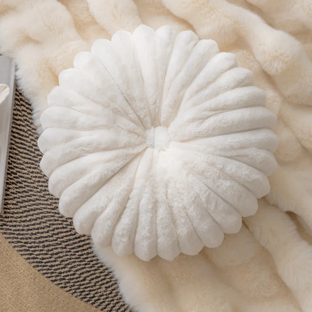 Nutshell white plush round pumpkin pillow cushion on soft beige blanket