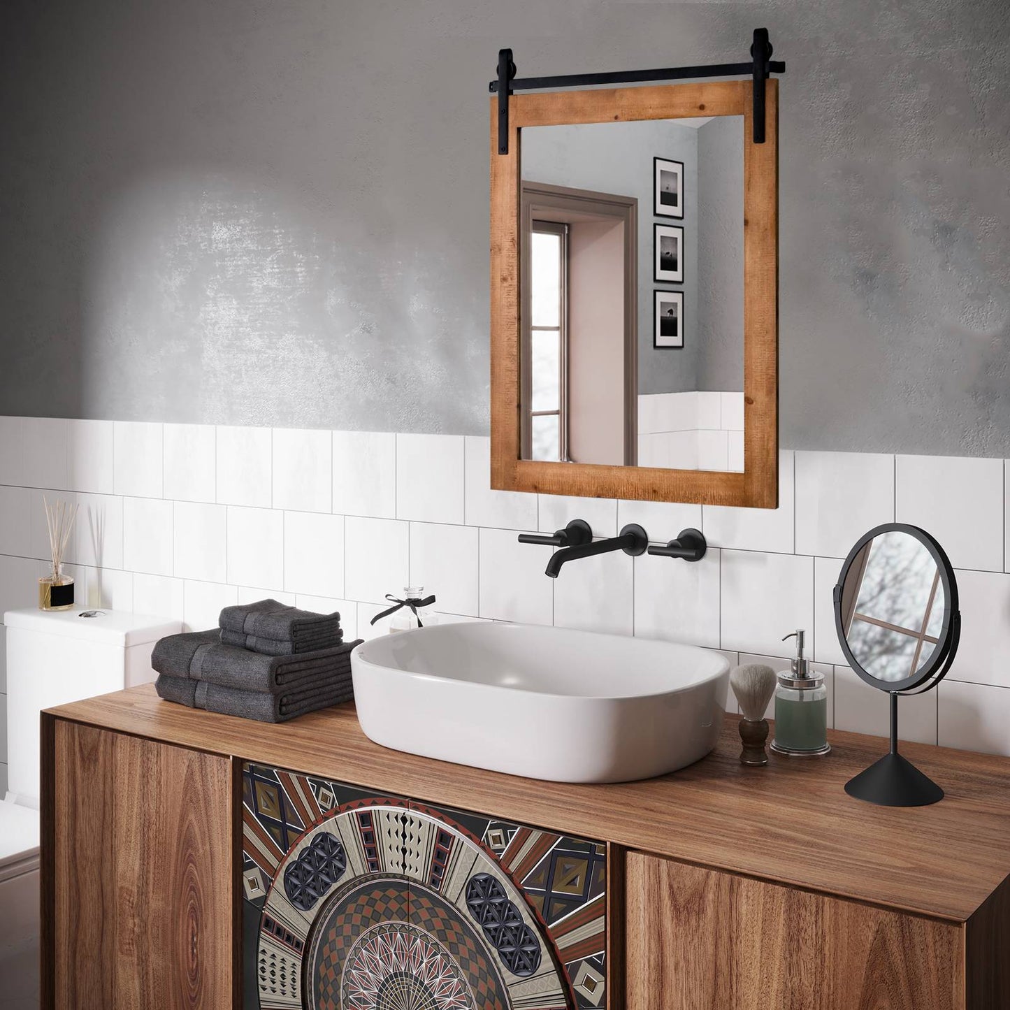 Nutshell wall-mounted wooden vanity mirror with black metal hardware above bathroom sink and wooden vanity