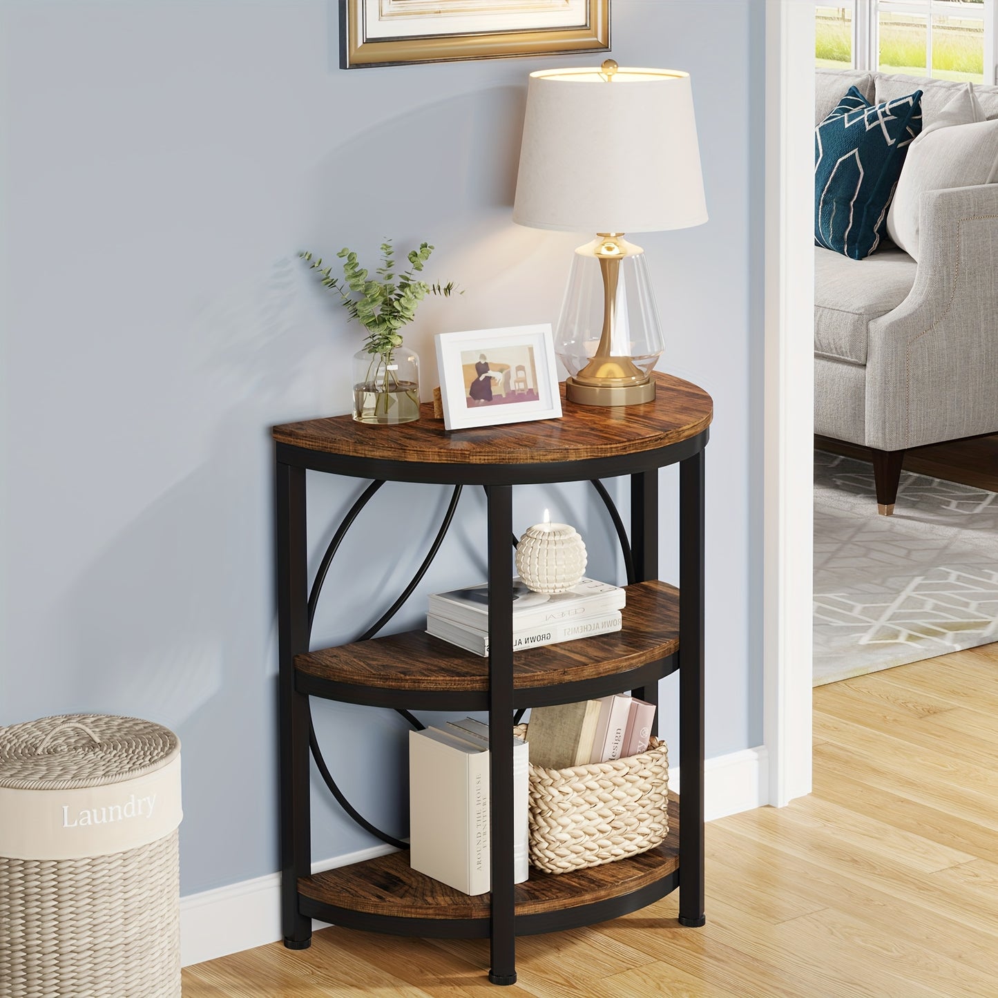 Nutshell vintage industrial end table with metal frame and wooden shelves holding lamp and decor
