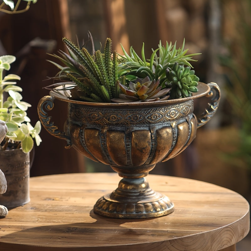 Nutshell vintage wrought iron pot vase with ornate design holding green succulent plants