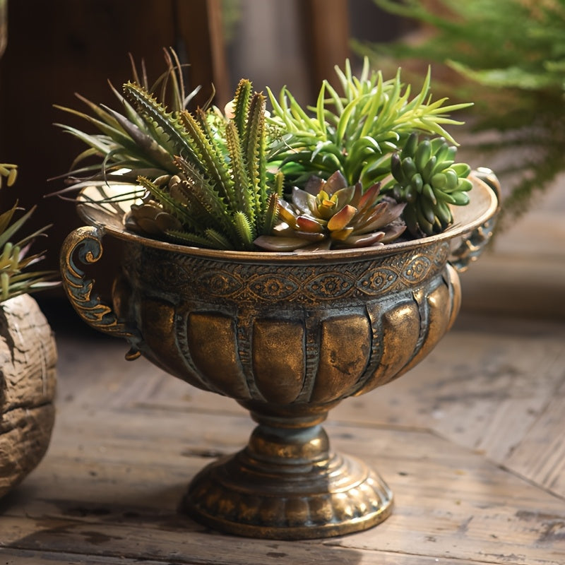 Nutshell vintage wrought iron pot vase with ornate design filled with green succulent plants