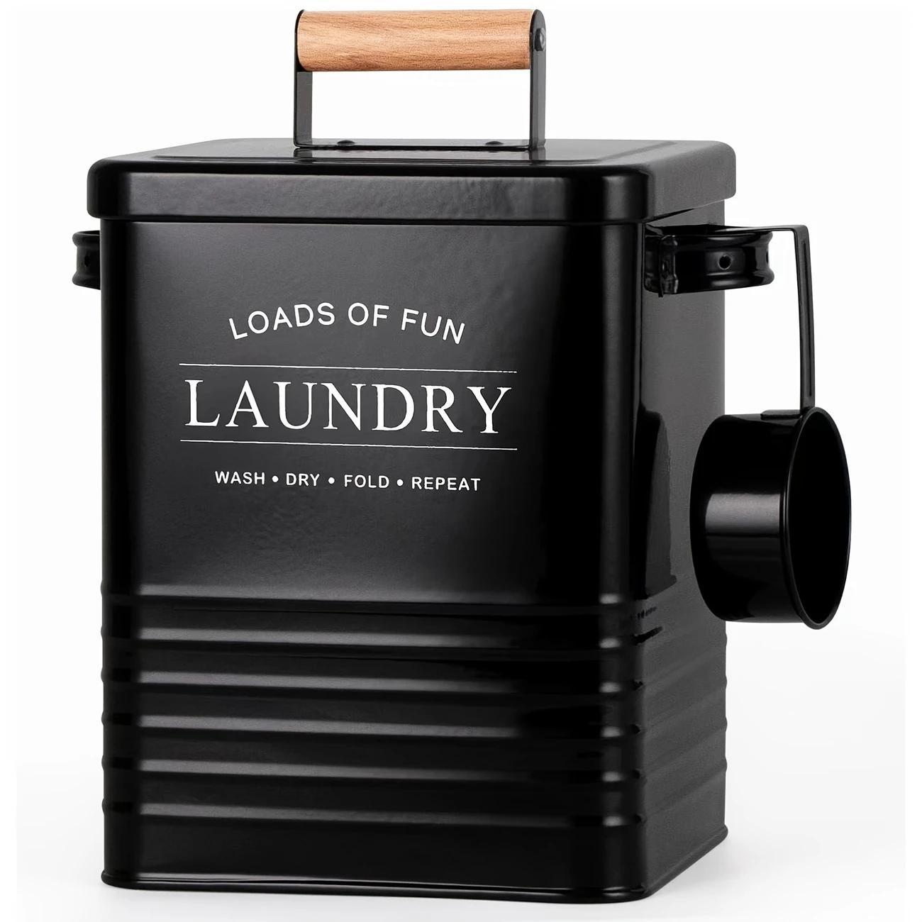 Nutshell wall-mounted laundry storage bin in black with a wooden handle for organized laundry.