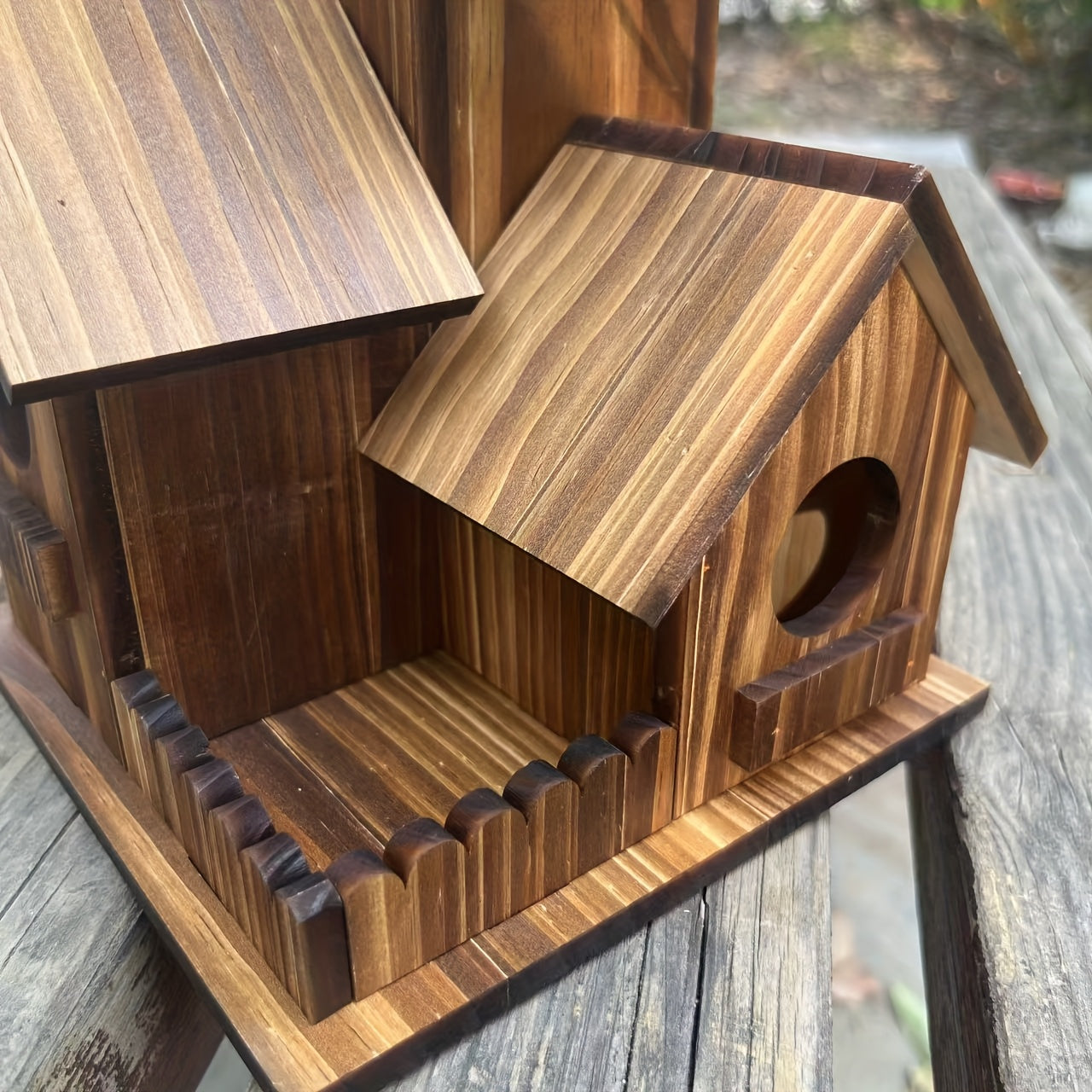 Close-up of a beautifully crafted Wooden Birdhouse with intricate detailing and natural wood finish