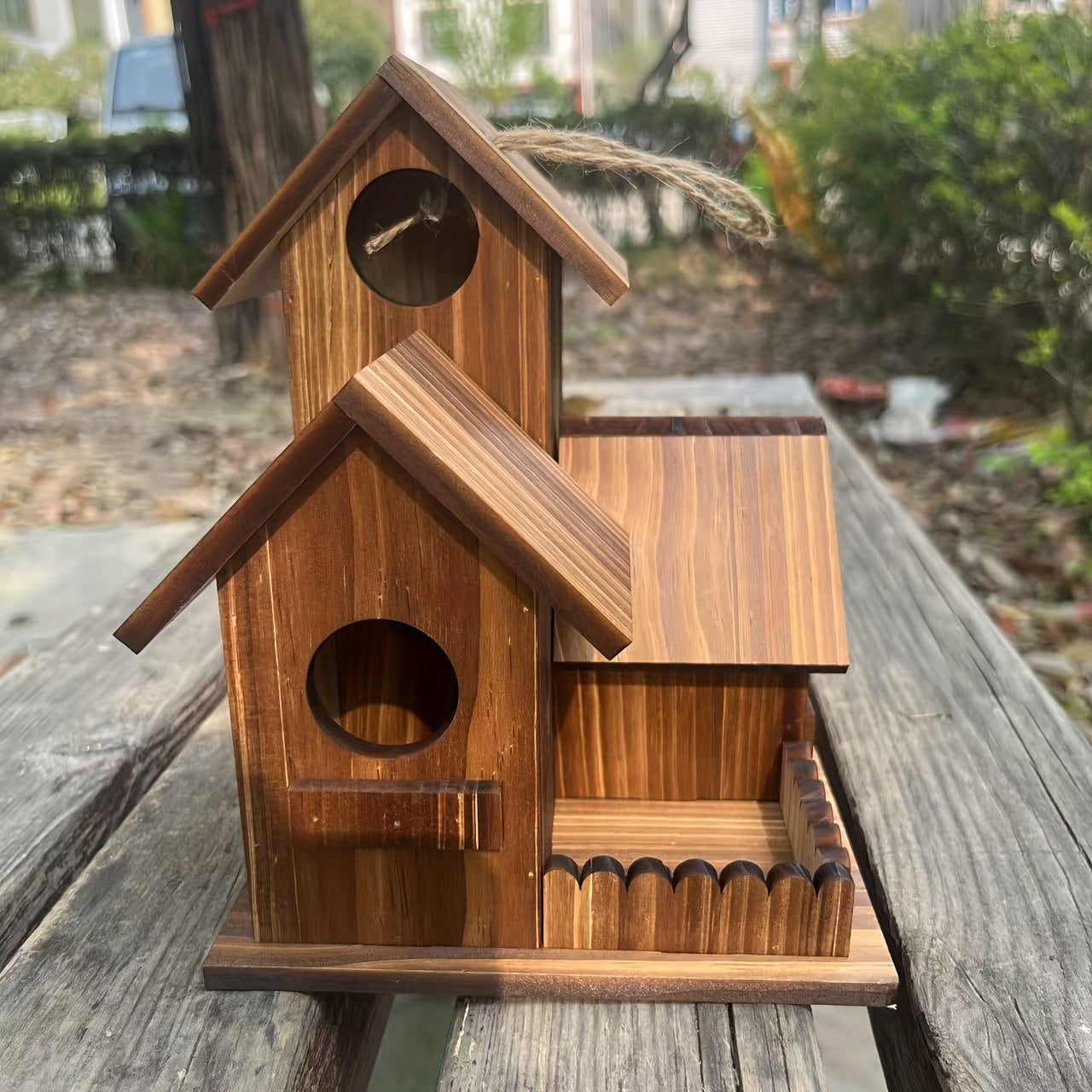 Handcrafted wooden birdhouse by Nutshell featuring unique design and natural finish