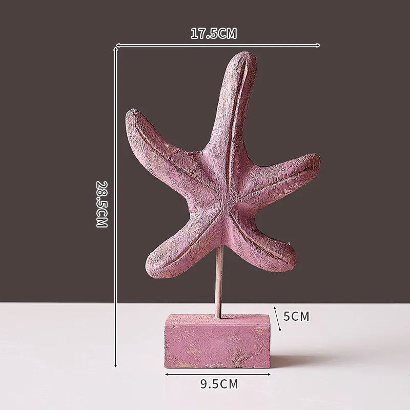 Pink wooden starfish ornament on a stand perfect for wooden ocean theme decorations by Nutshell