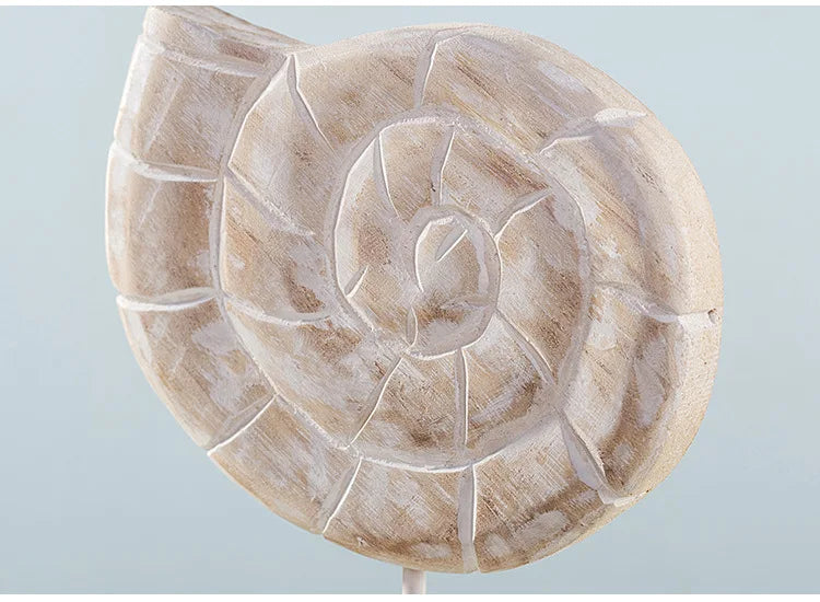 Nutshell wooden ocean theme decorations featuring a carved spiral shell ornament in natural wood tones
