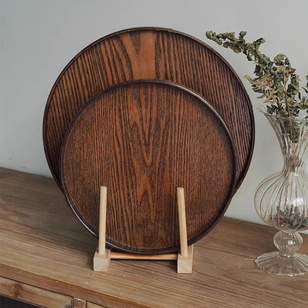 Nutshell wooden serving tray set with two round trays displaying rich wood grain on a stand