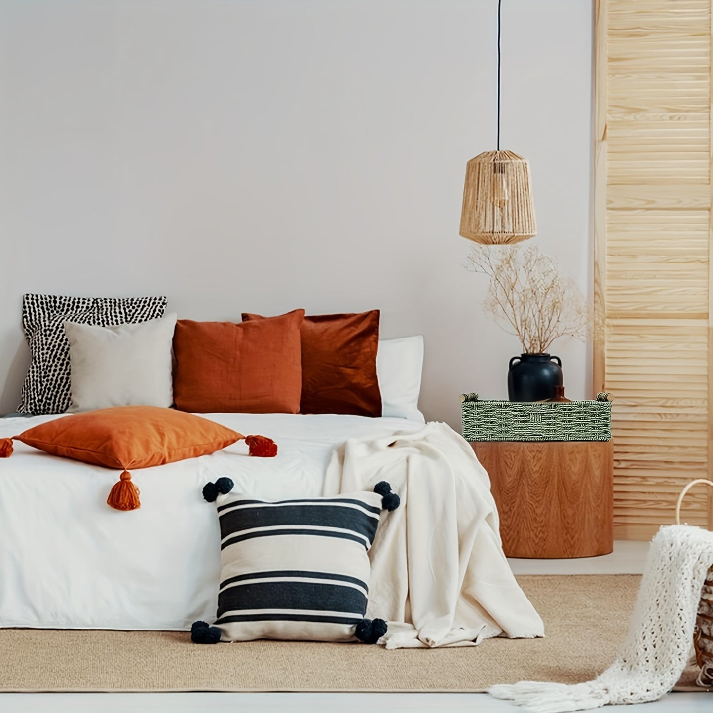 Nutshell woven storage basket in a stylish bedroom setting with decorative pillows and cozy decor