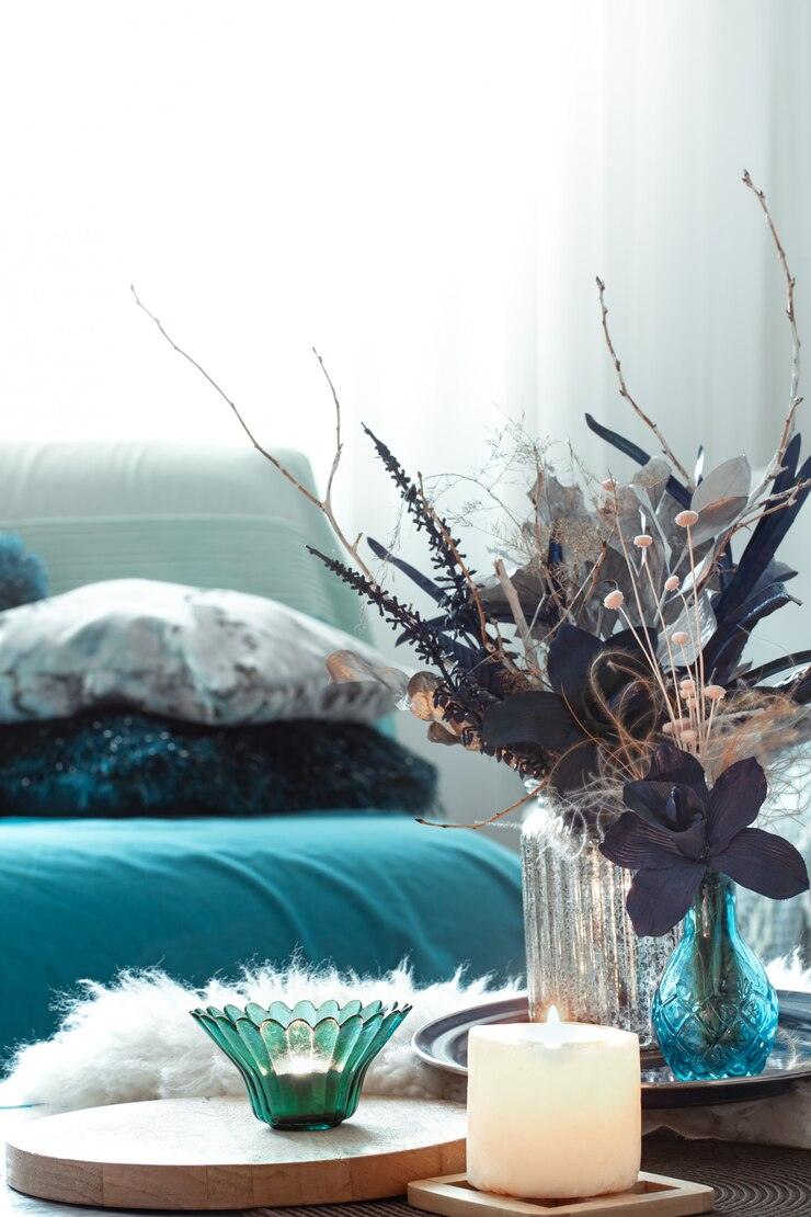 Elegant Home Decor with Decorative Vases, Candles, and Floral Arrangements in a Cozy Setting