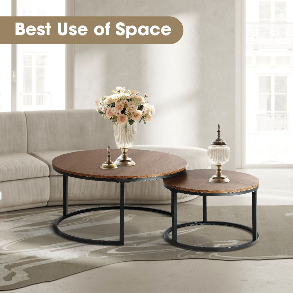 2pcs Round Nesting Coffee Table Set with wooden tops and black metal frames in modern living room