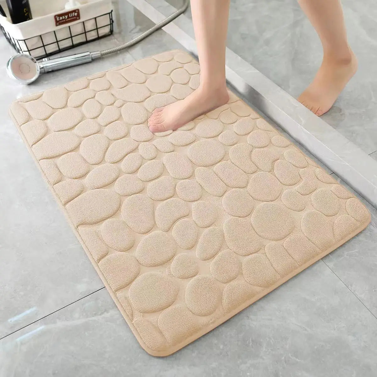 Nutshell 3D non slip bathroom mat in beige with a textured pebble design for safety and comfort