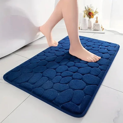 Nutshell 3D non slip bathroom mat in navy blue with a textured pebble design for safety and comfort