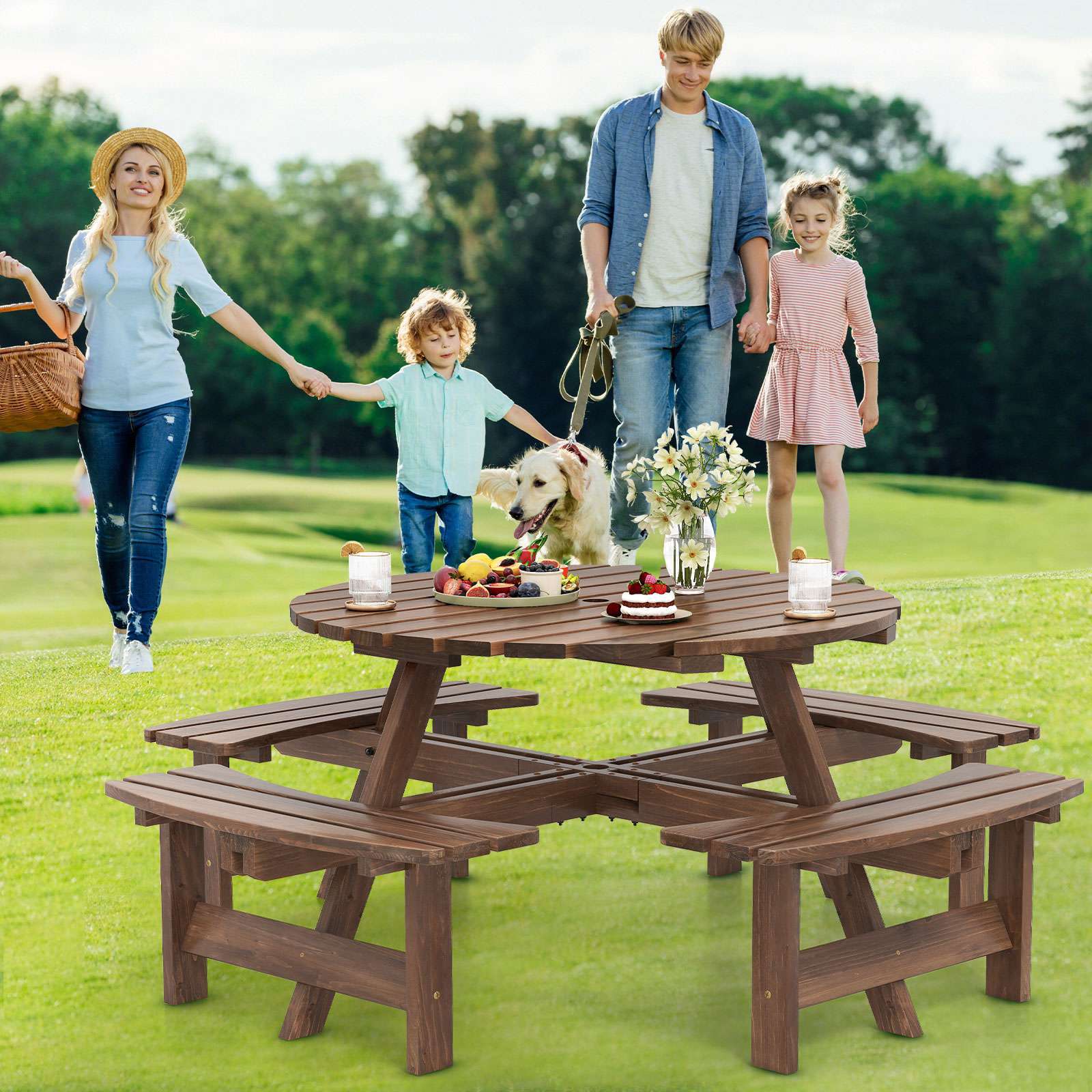 Nutshell 8-Person Round Picnic Table in a lush park setting with family enjoying the outdoors