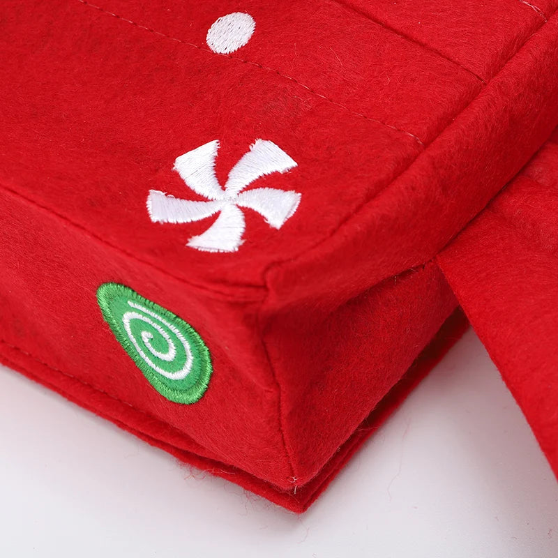Festive red Christmas tissue box cover with candy designs for holiday decor