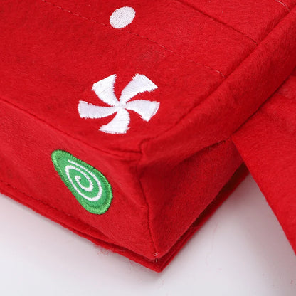 Festive red Christmas tissue box cover with candy designs for holiday decor