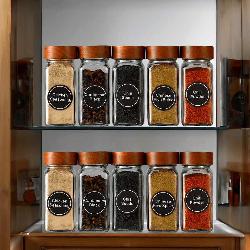 Acacia wood spice jars set displaying various spices for organized kitchen storage