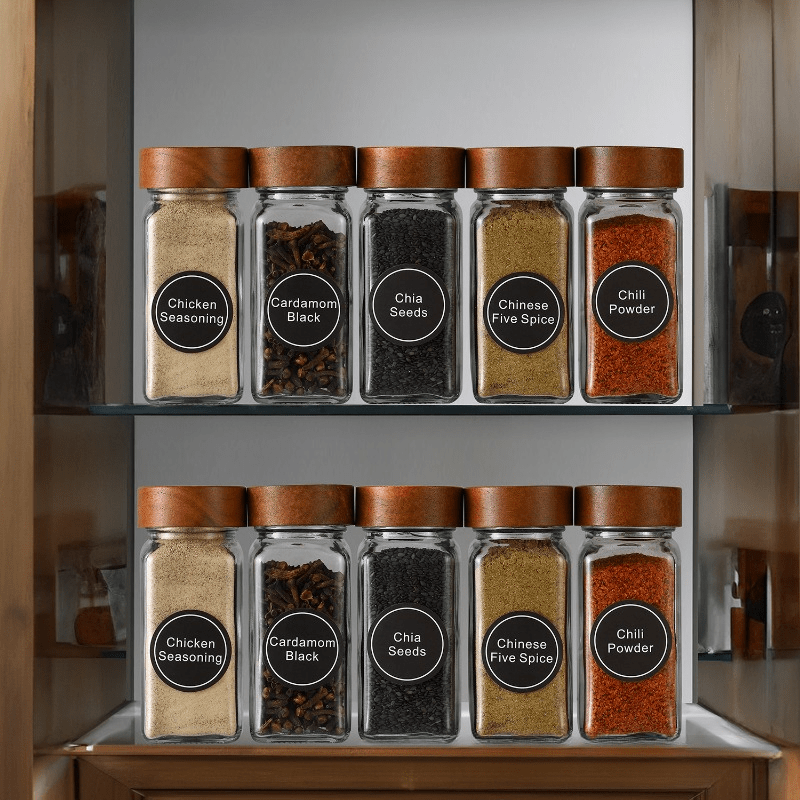 Nutshell Acacia wood spice jars set with various spices on a kitchen organizer shelf