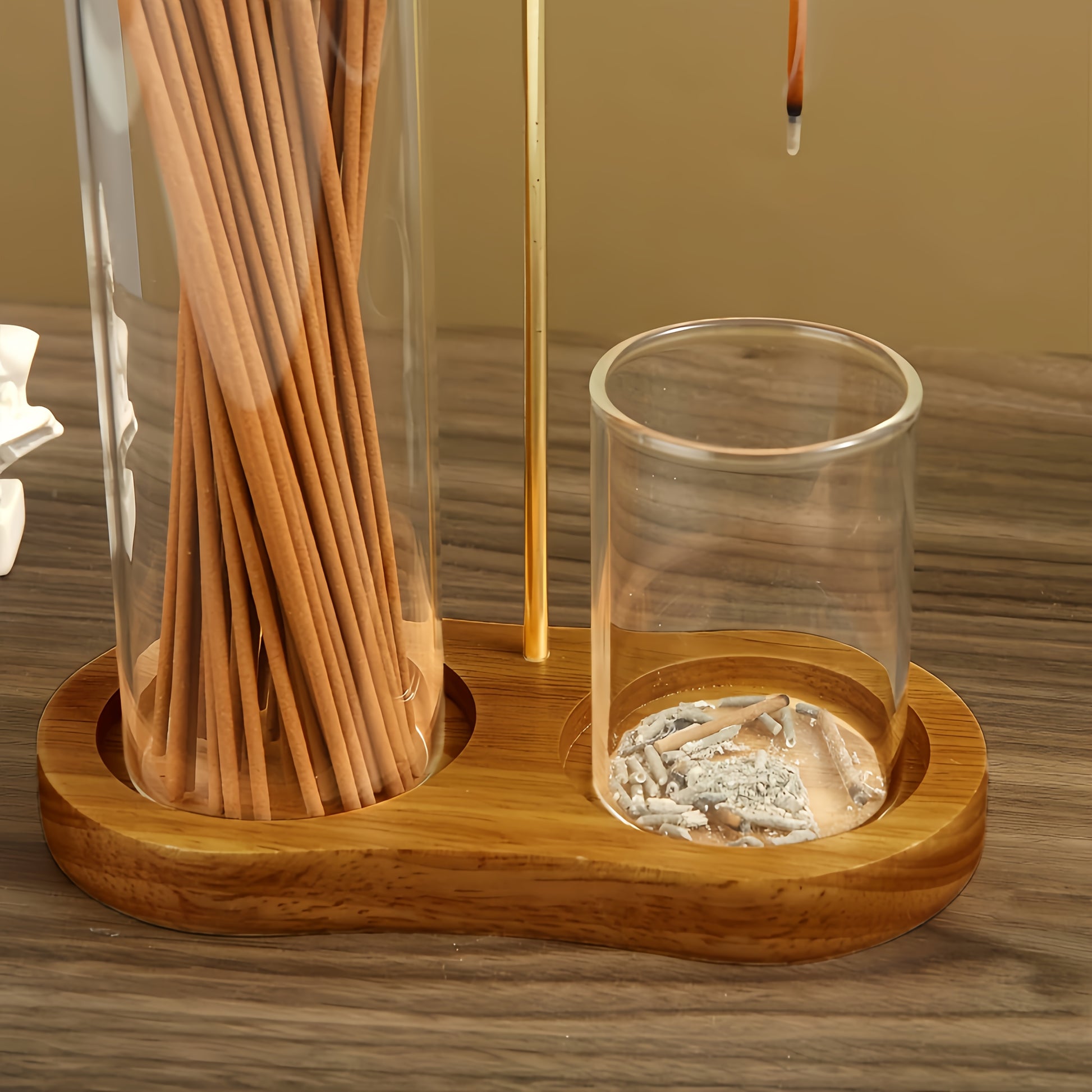 Nutshell anti-ash incense holder with storage featuring a stylish wooden base and glass containers