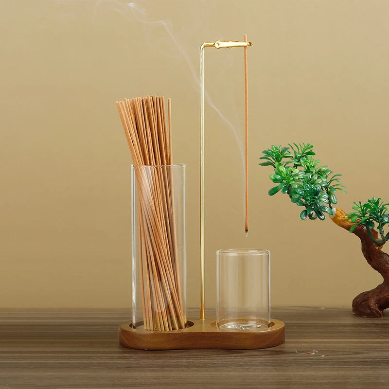 Nutshell anti-ash incense holder with storage featuring a wooden base and glass containers for incense sticks