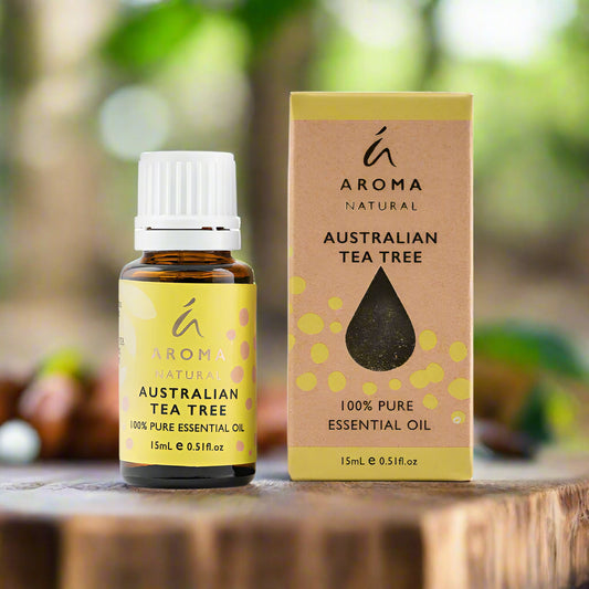 Nutshell Aroma Natural Australian Tea Tree Essential Oil 15mL bottle and box on wooden surface
