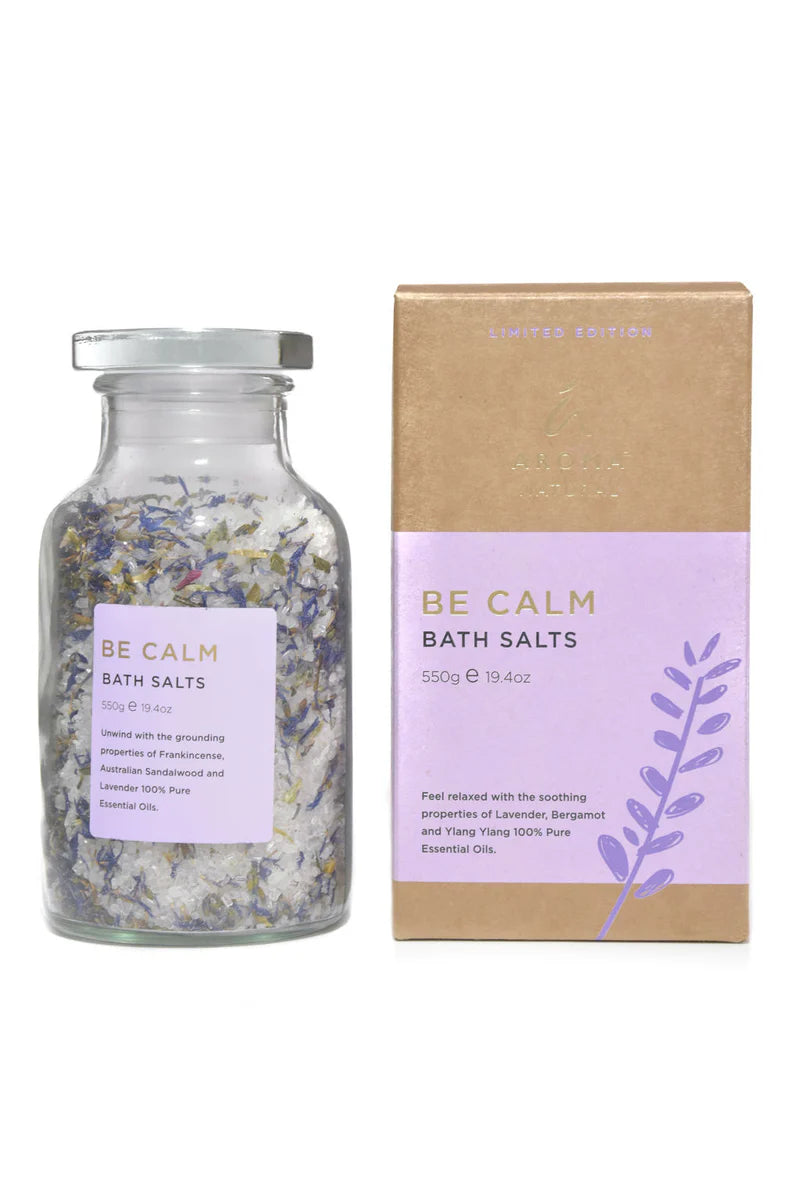 Nutshell Be Calm Bath Salts in glass jar with lavender and flower petals next to product box