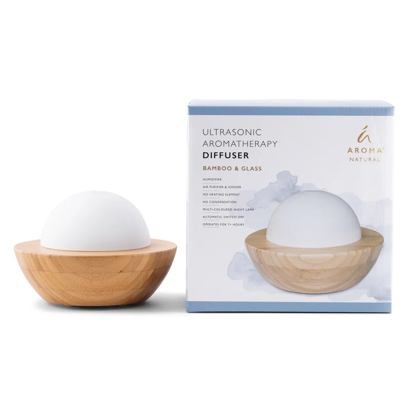 Nutshell bamboo essential oil diffuser with ultrasonic aromatherapy and wooden base next to product packaging