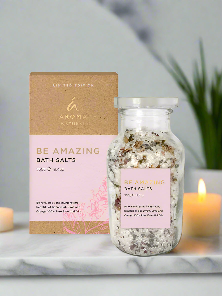 Nutshell Be Amazing Bath Salts in clear jar with decorative cardboard box on marble surface