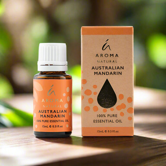 Nutshell Australian Mandarin Essential Oil 15mL bottle and box with orange label on wooden surface