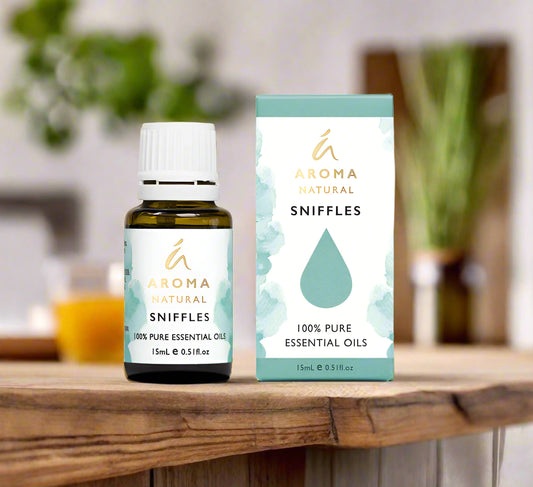 Nutshell Aroma Natural Sniffles Essential Oil Blend bottle and box on wooden surface