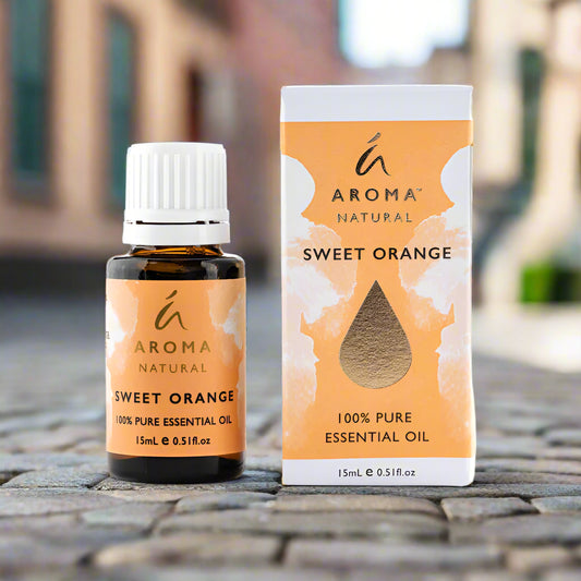 Nutshell Aroma Natural Sweet Orange Pure Essential Oil 15mL bottle and box on cobblestone surface