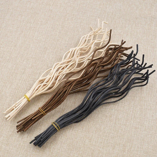 Nutshell aromatherapy wavy reed diffuser sticks in natural, brown, and black colors bundled together