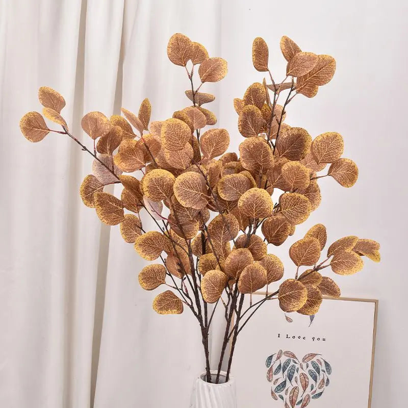 Artificial eucalyptus bouquet in warm golden tones, perfect for home decor and floral arrangements