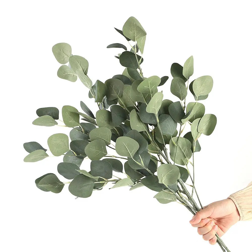 Beautiful artificial eucalyptus bouquet held in hand, ideal for home decor and arrangements