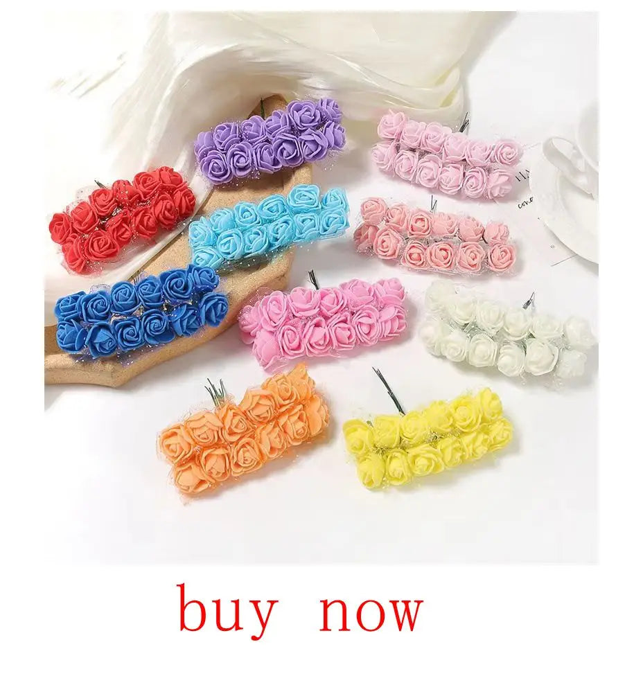 Colorful artificial eucalyptus bouquet with various rose arrangements in shades of pink, blue, and yellow