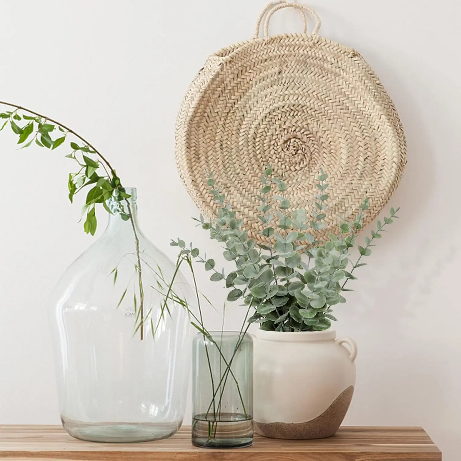 Stylish artificial eucalyptus wall hanging decor with natural woven basket and greenery accents